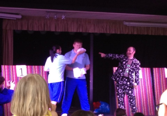Damian Jay onstage with two contestants and The Dreaded Custard Pie - The Funky Funhouse Show Damian Jay onstage with two contestants and The Dreaded Custard Pie - The Funky Funhouse Show